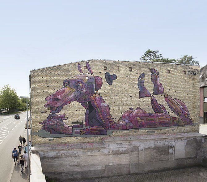 A bizarre man animal hybrid lies in a bored pose in this enormous street art mural by graffiti artist Aryz