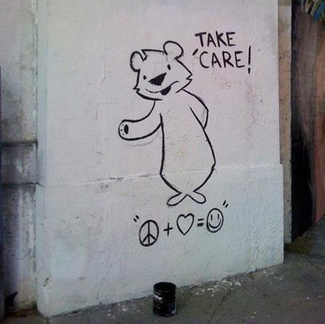 A friendly bear reminds us to take care in this graffiti painting by street artist Phil Lumbang