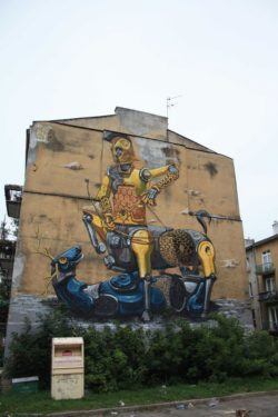 A robot knight slays a robot stag in this surreal street art work by graffiti artist Pixel Pancho