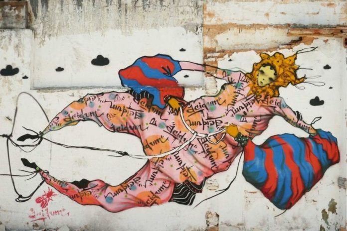 Latin American graffiti artists Grupo Acidum merge their art skills to create this unusual mural