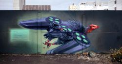 A vulture sprouts a pair of game controller wings in this science fiction street art painting by Wes 21