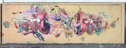 Dhear One does an autopsy on an alien creature in this colorful graffiti mural