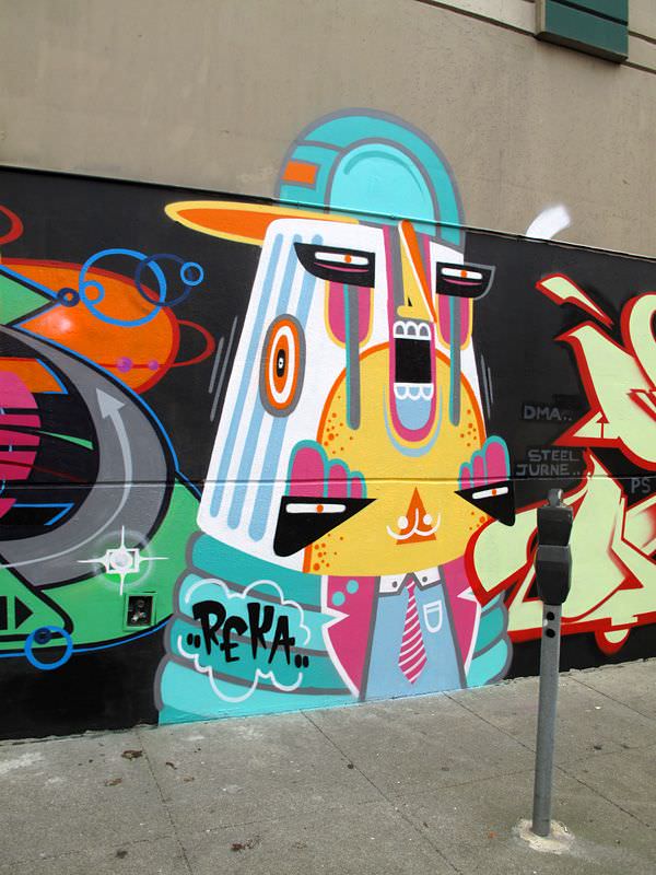 Graffiti artist Reka One uses a fun ice cream color palette to create this funky street art mural