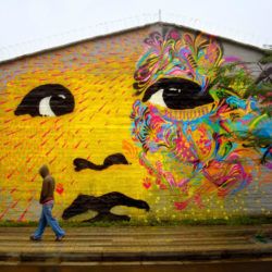 Stinkfish tranforms a portrait of a baby into a large, spiritual street art mural