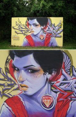 A beautiful girl with an ugly expression challenges passers by in this remote street art painting by Erase