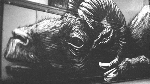 This animated graffiti GIF turns a creature into a carcass