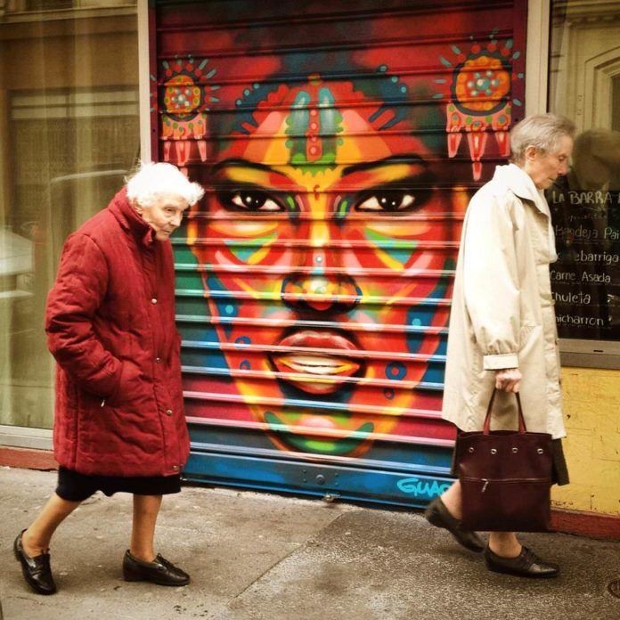 A garage door in Paris now sports a colorful portrait due to the time and effort of street artist Guache