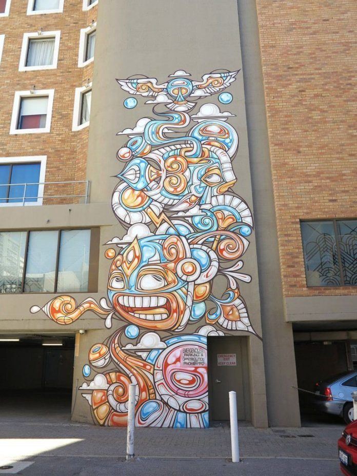 Cartoon animals frolic with elements of nature in this tribal street art painting by graffiti artist Phibs
