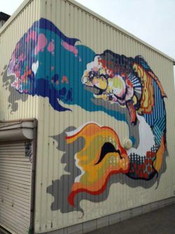 Street artist Titi Freak gives this mural of two fish texture with geometric shapes and patterns