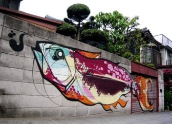 Titi Freak combines Japanese art styles with Brazilian colors in this street art mural of a giant fish