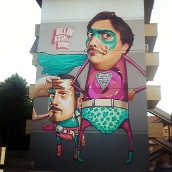 Funny superheroes wear Spanish moustaches in this pop surrealism street art mural by graffiti artist Belin