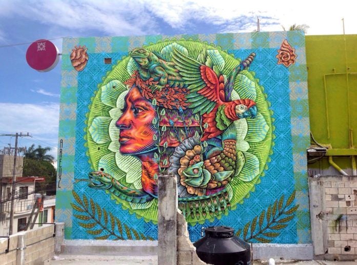 Creatures of the Mexican rainforest coexist with mankind in this large and colorful street art mural by Areúz