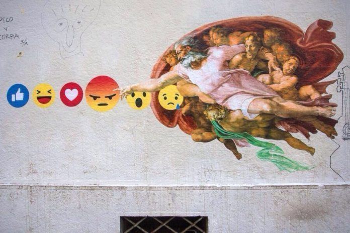 Michelangelo's Sistine Chapel painting of God reaching out to man has been changed to God reaching out to a series of emoticons in this creative and funny street art mural