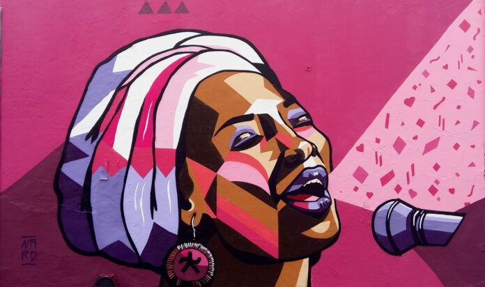 Graffiti mural painter Nardstar has given this female African singer powerful pinks and purples to accentuate her song and her femininity